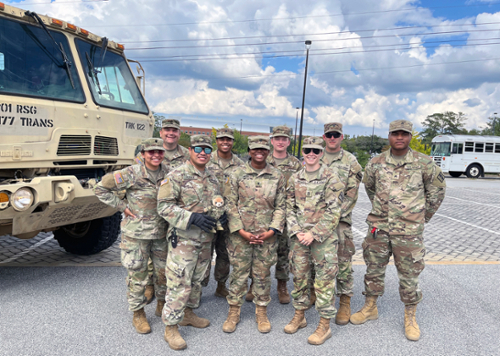 MGA welcomed to the Macon Campus members of the Georgia National Guard, 1177th Transportation Company and 265th Chemical Battalion, as they set up a staging area in one of the campus's west parking lots as part of the state's Hurricane Helene relief efforts. Sgt. 1st Class Mary Howell said their role involved transporting FEMA and GEMA supply trailers to various locations with water, ready-to-eat meals, and other supplies to hard-hit locations in Georgia. Image: Sheron Smith